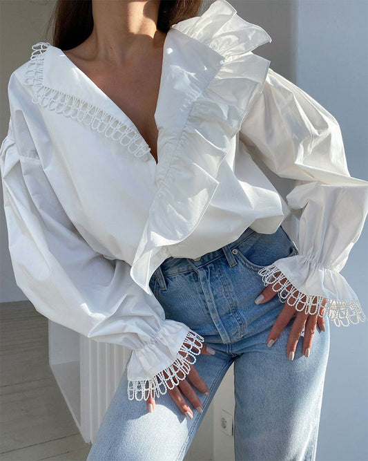 Blusa de manga larga con volantes y asimetría con cuello en V