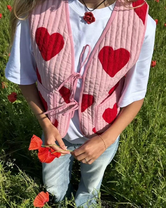 Chaleco sin mangas con cuello en V y lazo rosa con estampado de corazón
